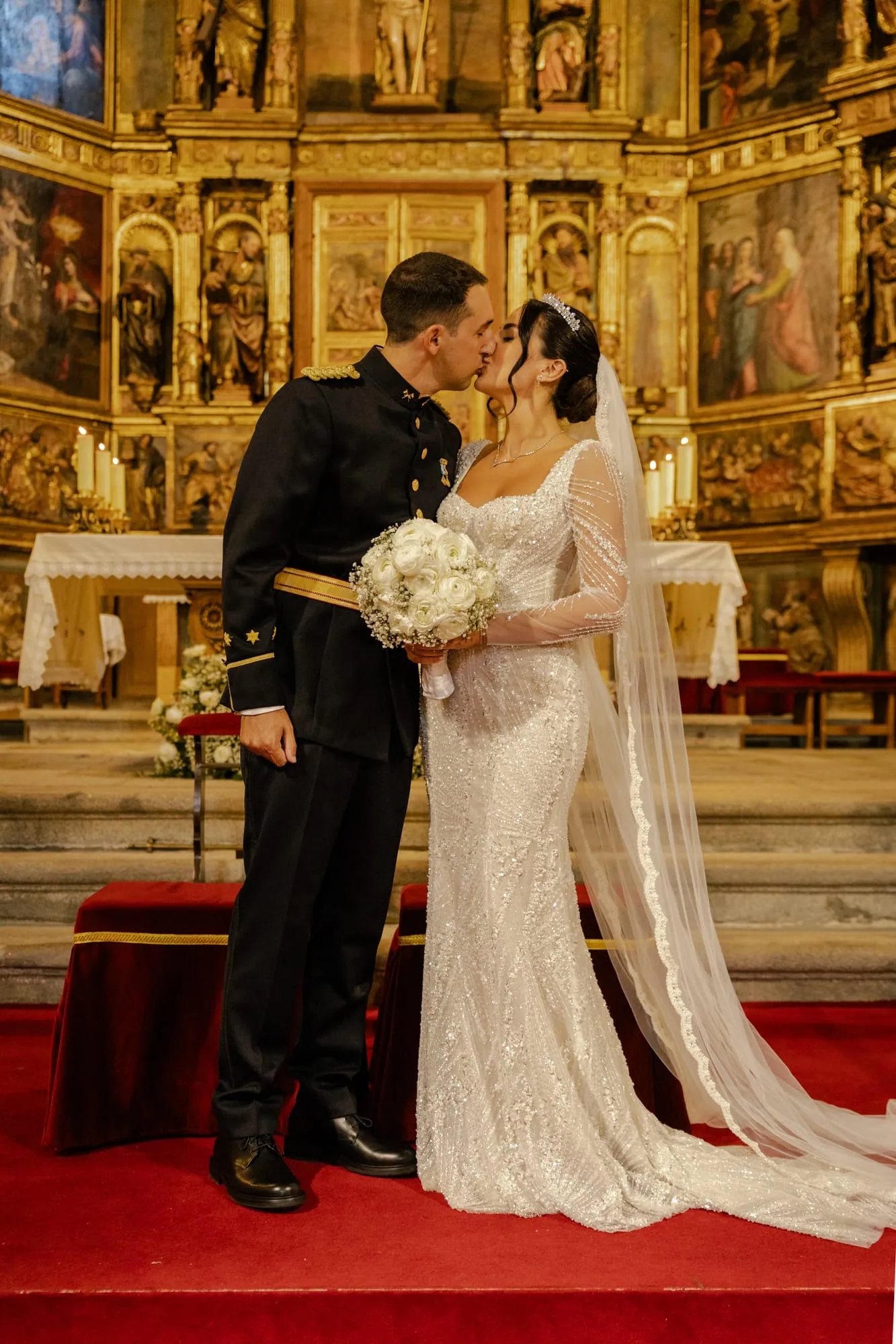 Pamela and José before the gilded altarpiece of the church
